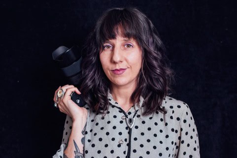 Photographer holding camera for Vermont wedding photography.