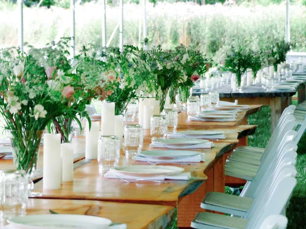 Elegant wedding reception table with floral arrangements at Vermont venue.