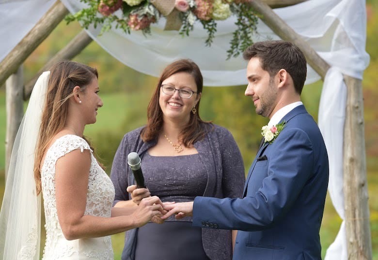 Bride and groom exchanging vows at Vermont Association of Wedding Professionals.