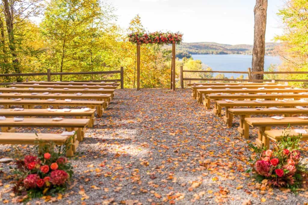 Outdoor wedding ceremony setup at Lake Bomoseen with scenic lake view.