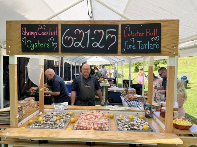 Vermont wedding catering booth with seafood and seafood dishes at Nor' Eastern.