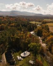 Scenic Vermont wedding venue with lush trees and mountain views at Talta Lodge.