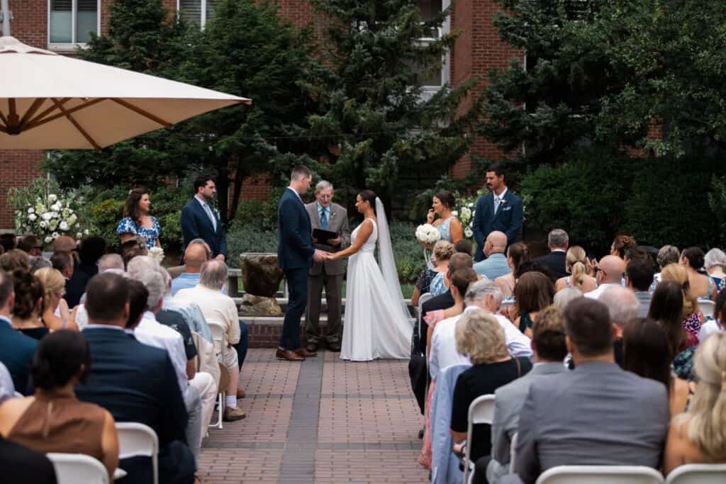 Outdoor wedding ceremony at The Harborvale with guests and wedding party.