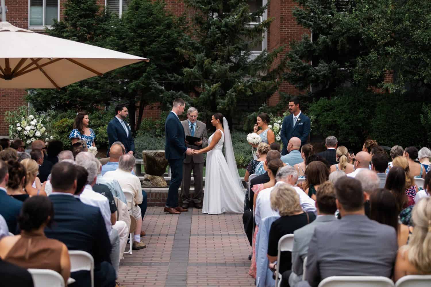 Outdoor wedding ceremony at The Harborvale with guests and wedding party.